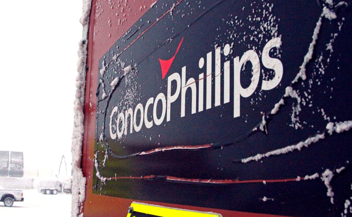 An ice-covered ConocoPhillips sign