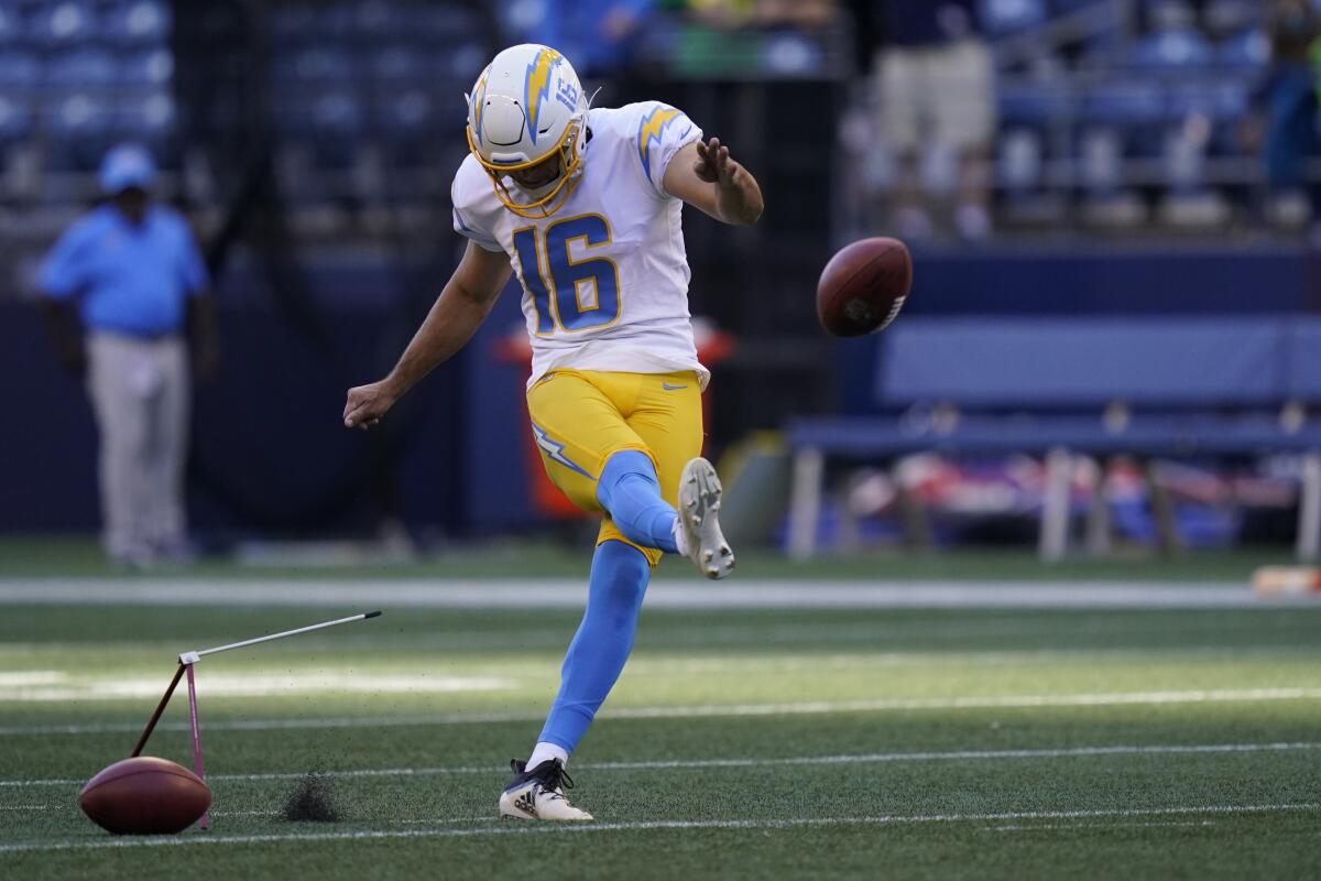 Tristan Vizcaino kicks during warmups before a Chargers preseason game.