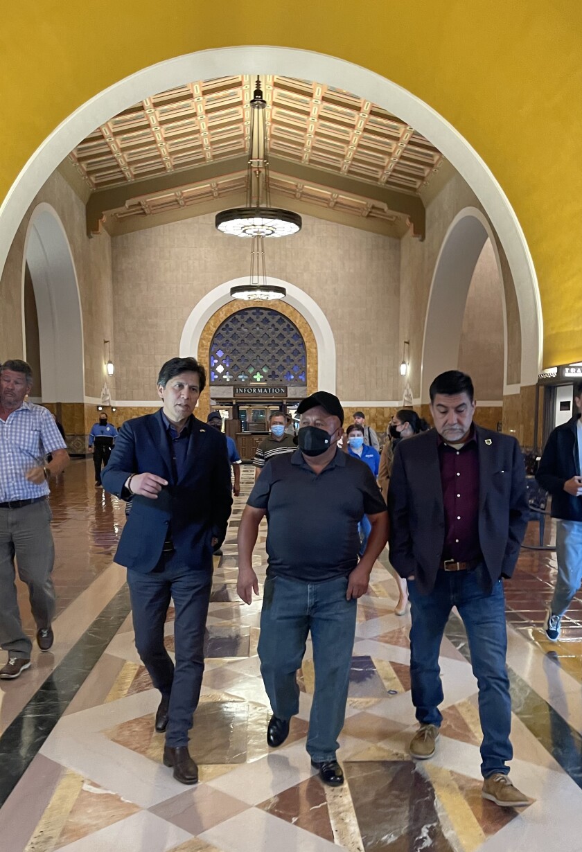 Los Angeles councilman Kevin de Leon tours Union Station on April 29 with janitor Gerardo Mixcoatl.