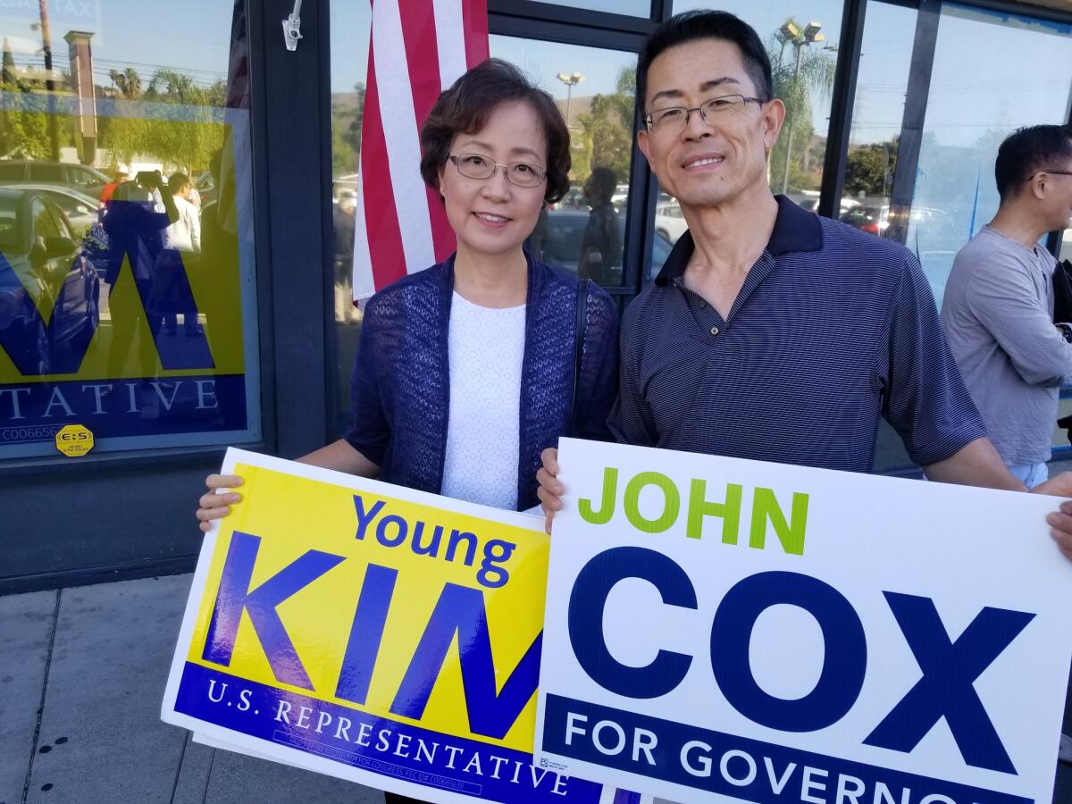 Paul Choi and his wife, Julianne, attend an event for Republican Young Kim in Rowland Heights on Saturday.