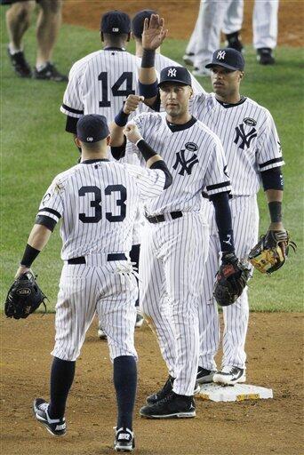 New York Yankees Outfielder Nick Swisher (#33) heads to first. The