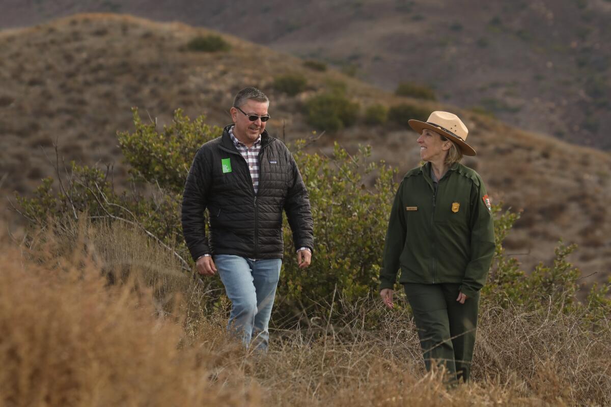Guillermo Rodriguez, California state director of Trust for Public Land, left, and Jody Lyle,
