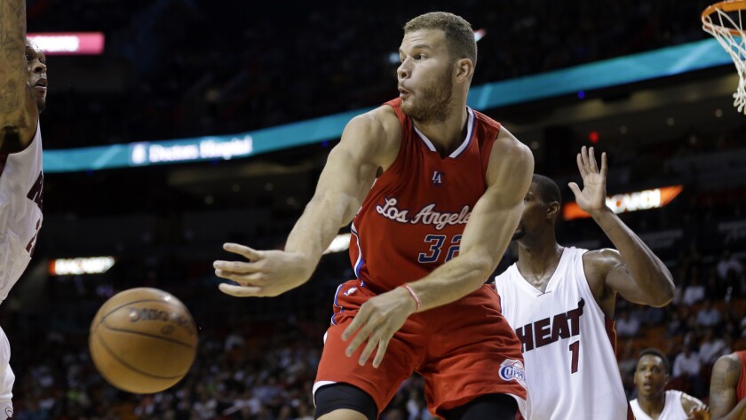 Clippers forward Blake Griffin, right, passes the ball around Miami Heat guard Danny Granger, left, during a Clippers' win on Nov. 20.