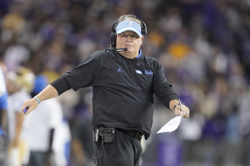 UCLA coach gestures on the sideline during the Bruins' win Saturday.