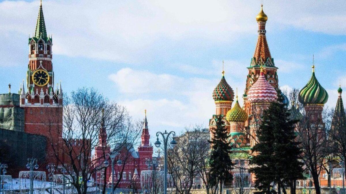 The Kremlin's Spasskaya Tower, the State Historical Museum and St. Basil's Cathedral are seen in Moscow on March 29, 2018. Moscow has ordered retaliatory expulsions of U.S. and Western diplomats.