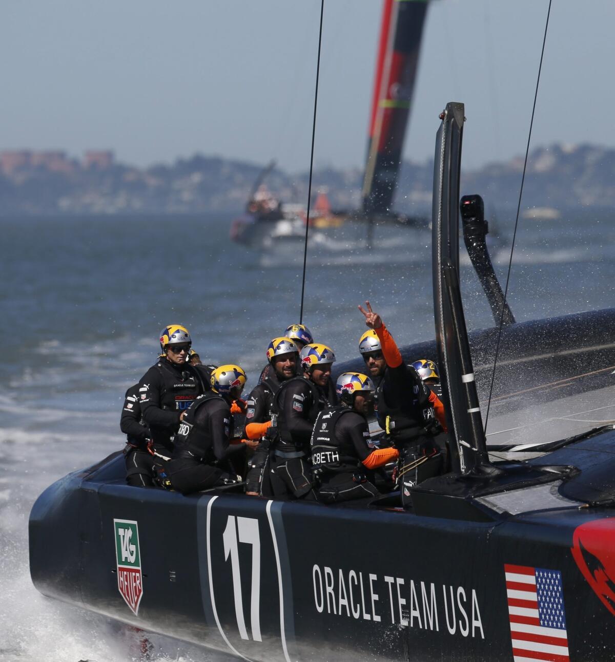 Oracle Team USA crosses the finish line to win Race 16 of the America's Cup in San Francisco Bay on Monday.