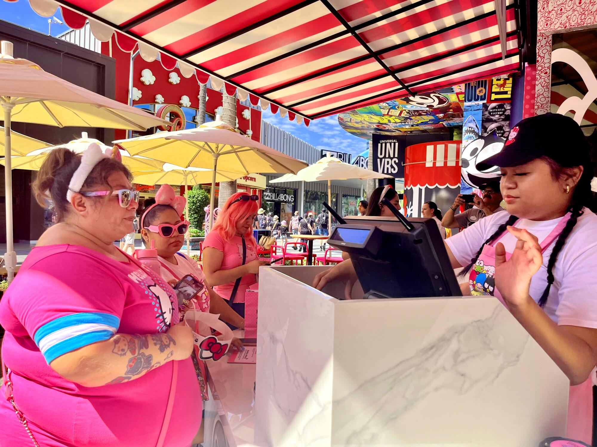 The first customers to order treats at the Hello Kitty and Friends Cafe at Universal CityWalk. 