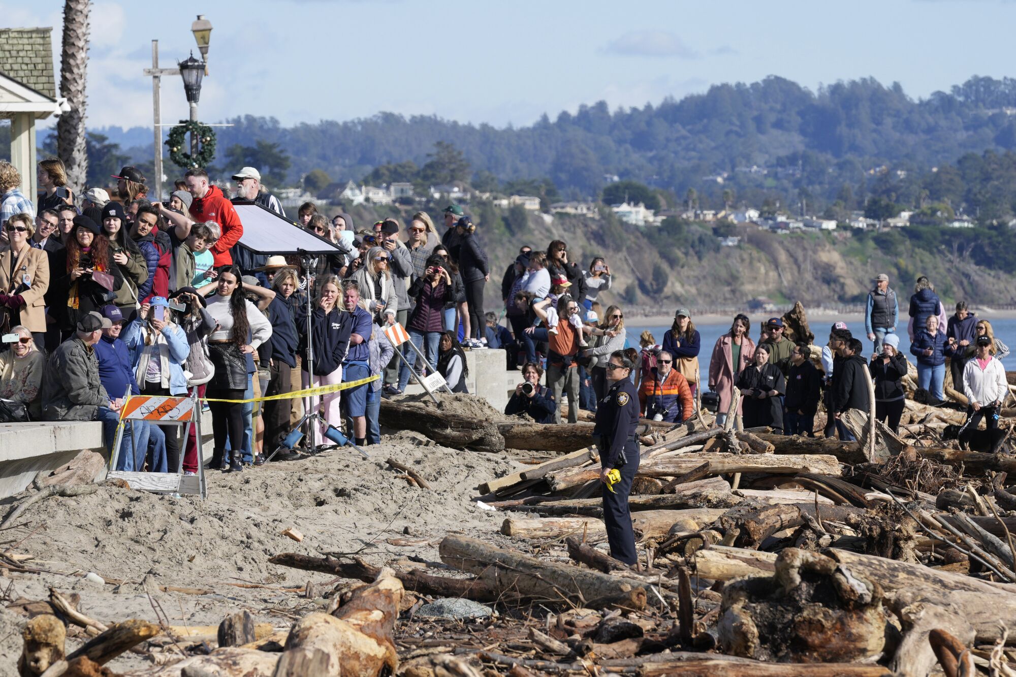 People watch from afar as Biden visits Capitola with business owners and residents