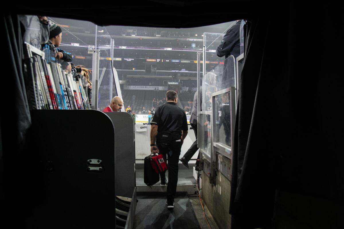 Kings trainer Chris Kingsley walks to the team bench during warmups before a game against the Edmonton Oilers at the Staples Center on Nov. 21. Kingsley is a cancer survivor.