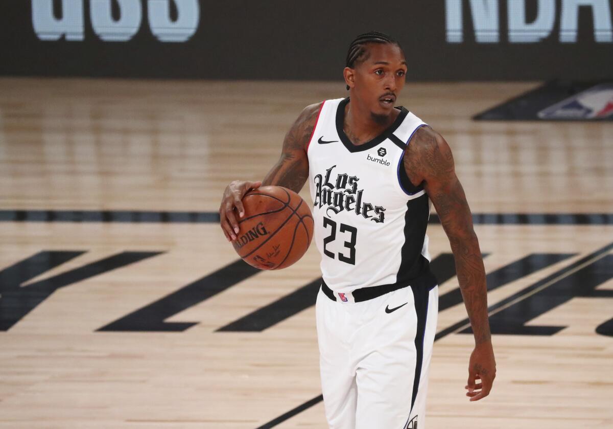 Clippers' guard Lou Williams controls the ball against the Denver Nuggets.