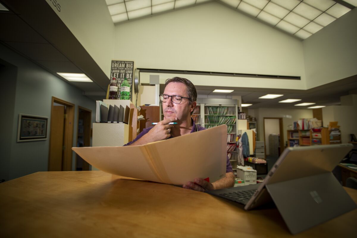 Dr. Bob Sears looks over patient files