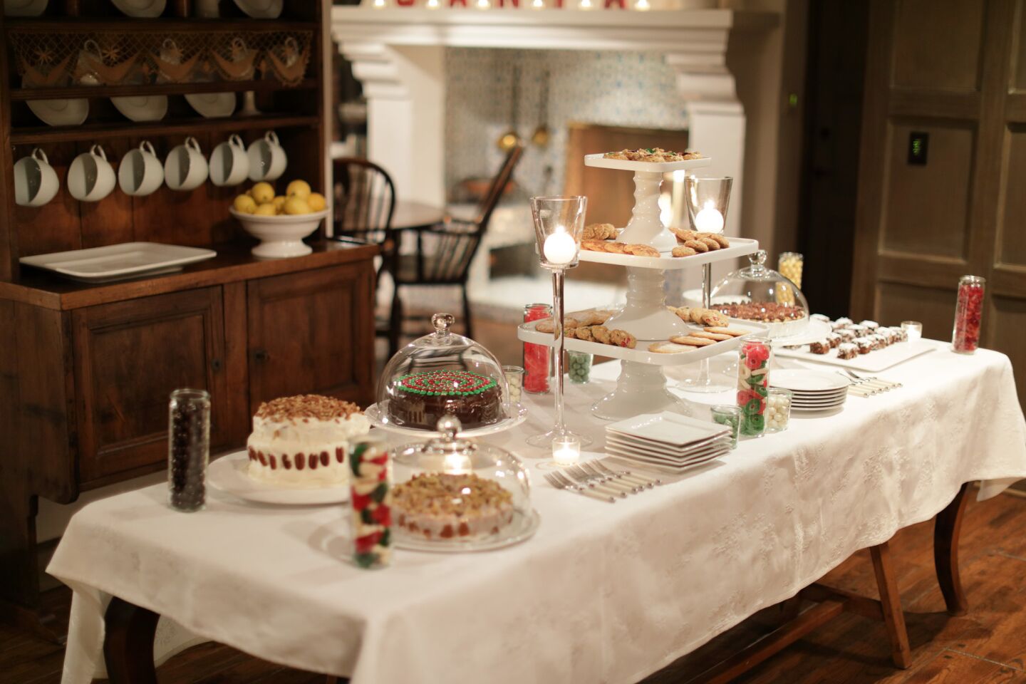 A dessert table holds sweets for post-Christmas Eve family dinner.