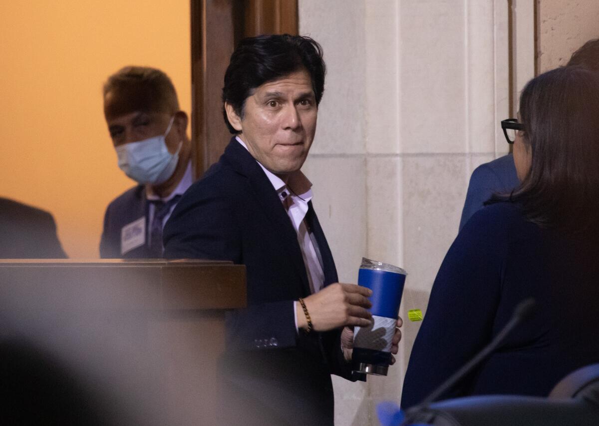 Councilman Kevin de León, center, among several others at City Hall