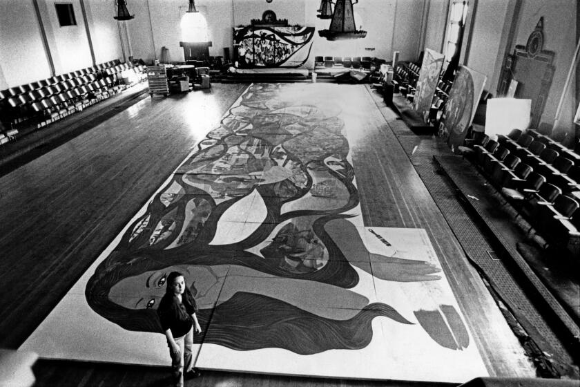 January 15, 1983 -- Barbara Carrasco's mural, commissioned for $6,000, lies partially assembled on a floor while its ownership is debated. (Jose Galvez / Los Angeles Times)