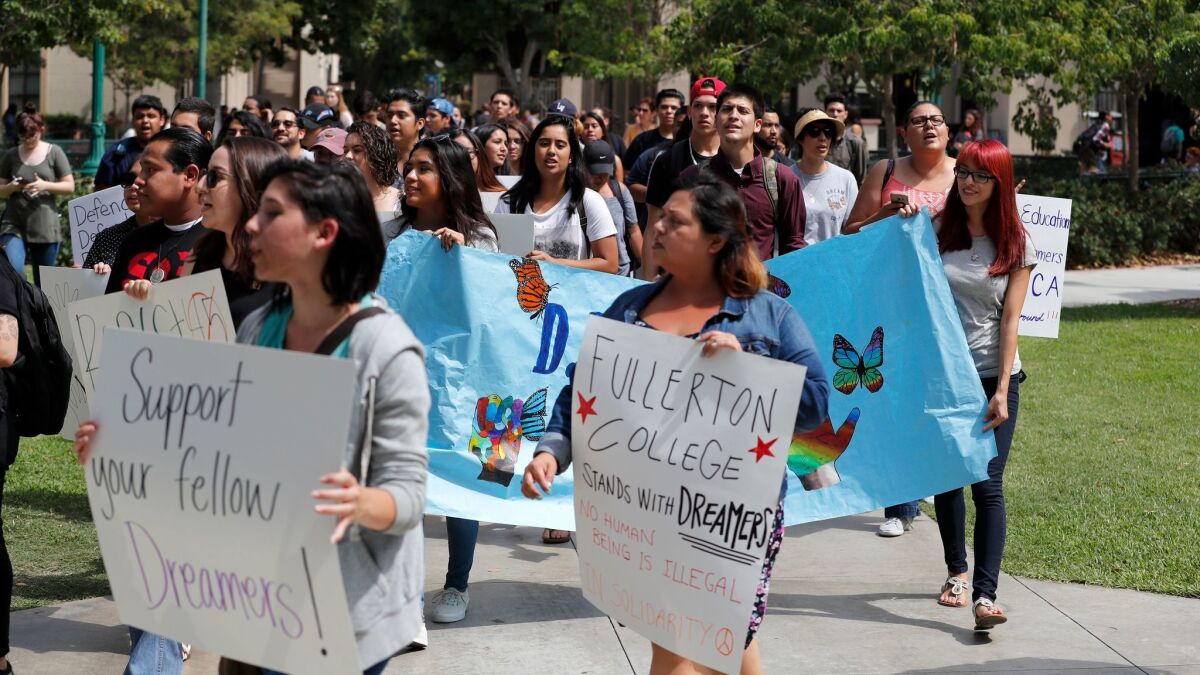 Students hold a rally of solidarity with Deferred Action for Childhood Arrivals students Sept. 14 at Fullerton College.