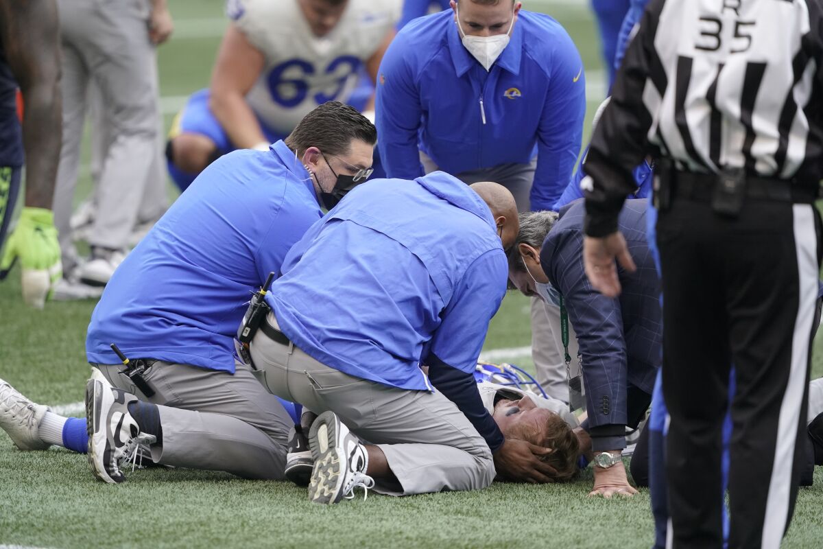 Rams quarterback John Wolford is tended to by medical personnel after being injured against the Seattle Seahawks.
