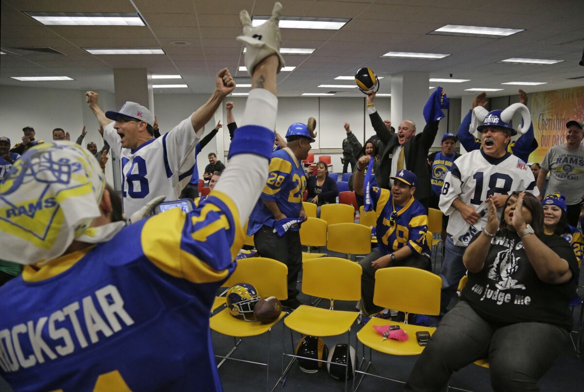 Supporters celebrate after the Inglewood City Council voted in 2015 to approve an 80,000-seat football stadium at the site of the old Hollywood Park racetrack.