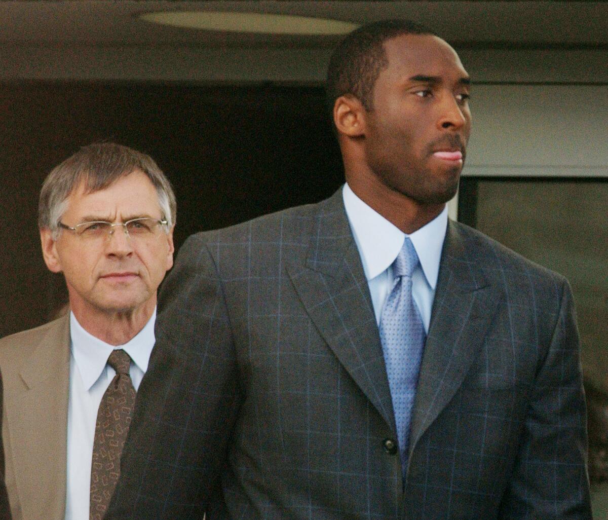 Kobe Bryant and attorney Hal Haddon leave the Eagle County (Colo.) Justice Center after the third day of jury selection for the trial on sexual assault charges.