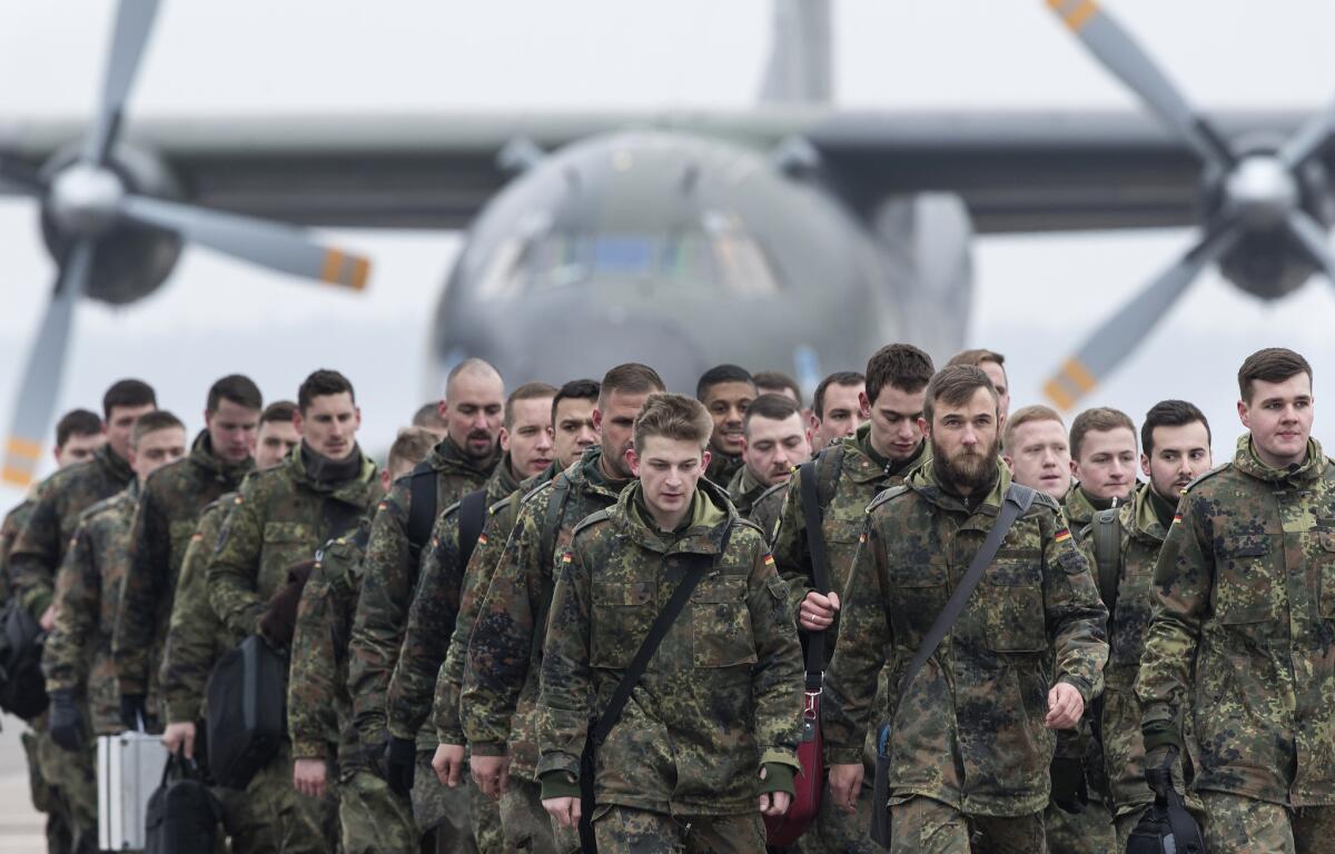 German soldiers arrive Feb. 1 in Lithuania as part of enhanced NATO presence to deter possible Russian aggression.