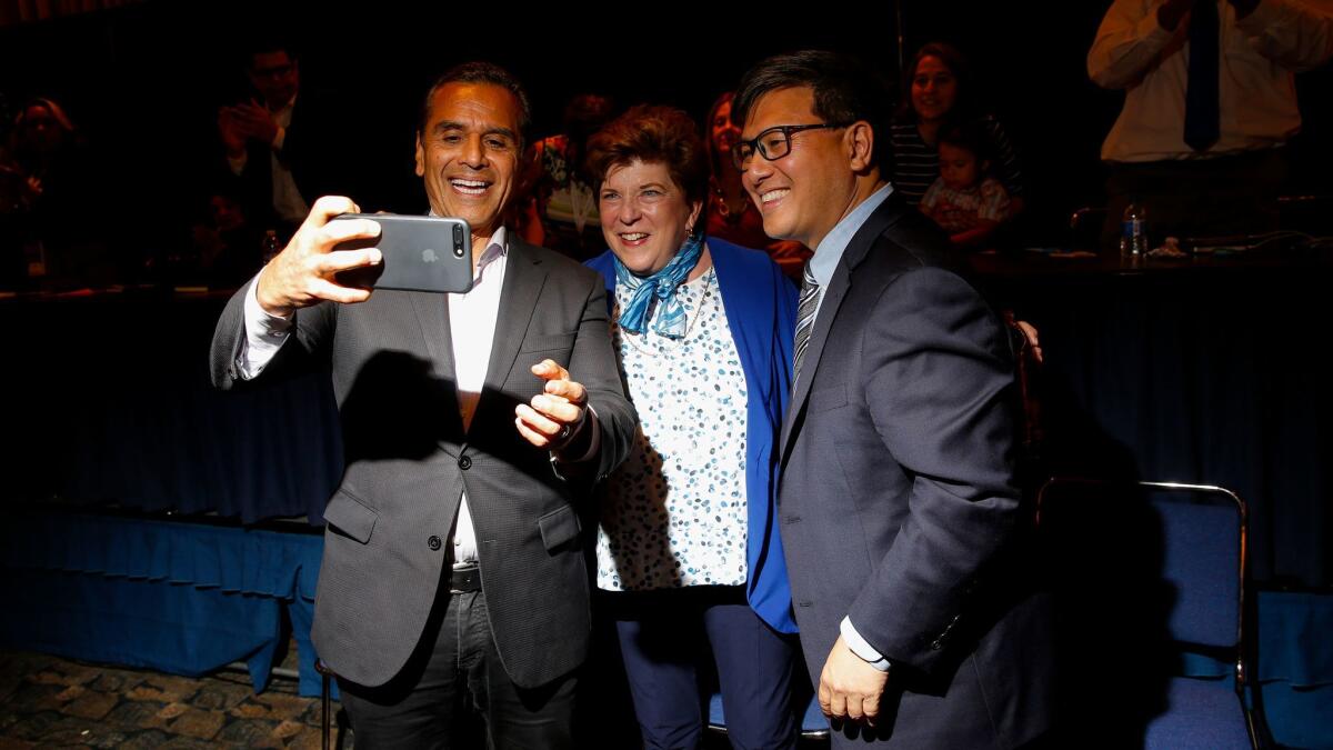 Former Los Angeles Mayor Antonio Villaraigosa, left, takes a selfie with fellow California gubernatorial candidates Delaine Eastin and Treasurer John Chiang following their speeches to the Chicano Latino Caucus at the California Democratic Party convention in Sacramento.
