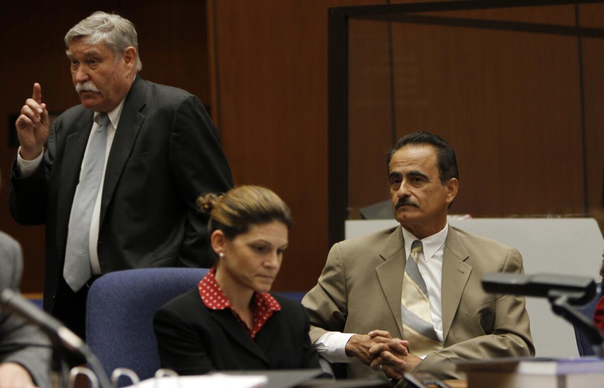 Attorney Richard Lasting, left, delivers an opening statement in defense of former Los Angeles City Councilman Richard Alarcon, seated next to attorney Courtney Overland.