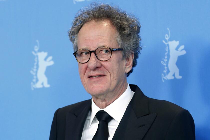 FILE - In this Feb. 12, 2013 file photo, actor Geoffrey Rush poses at the photo call for the film The Best Offer at the 63rd edition of the Berlinale, International Film Festival in Berlin. Oscar-winning actor Rush has been was awarded 2.9 million Australian dollars ($2 million) damages in a defamation case against a newspaper publisher and journalist over reports he had been accused of inappropriate behavior toward an actress. (AP Photo/Michael Sohn, File)