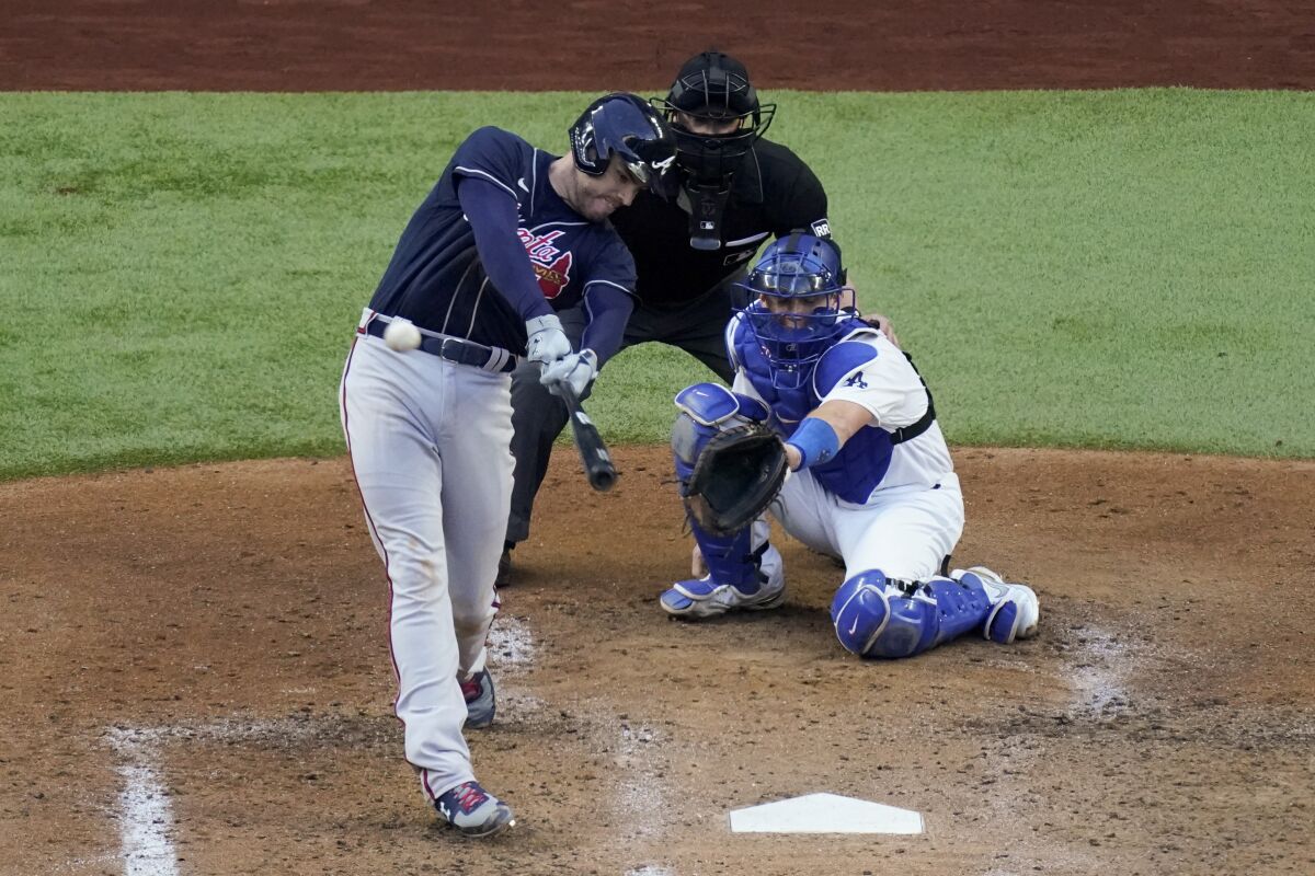 Atlanta Braves first baseman Freddie Freeman hits a two-run home run against the Dodgers.