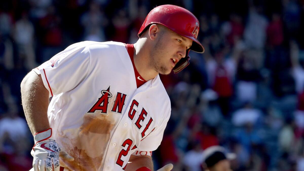 Angels center fielder Mike Trout rounds the bases after hitting a two-run homer against the Astros in the seventh inning on July 22, 2018, at Angels Stadium.