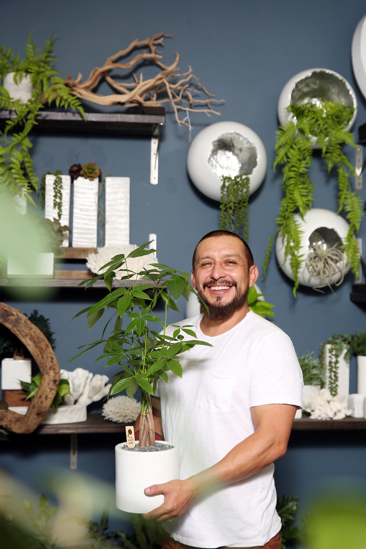 Felix Navarro in his Highland Park plant shop the Juicy Leaf
