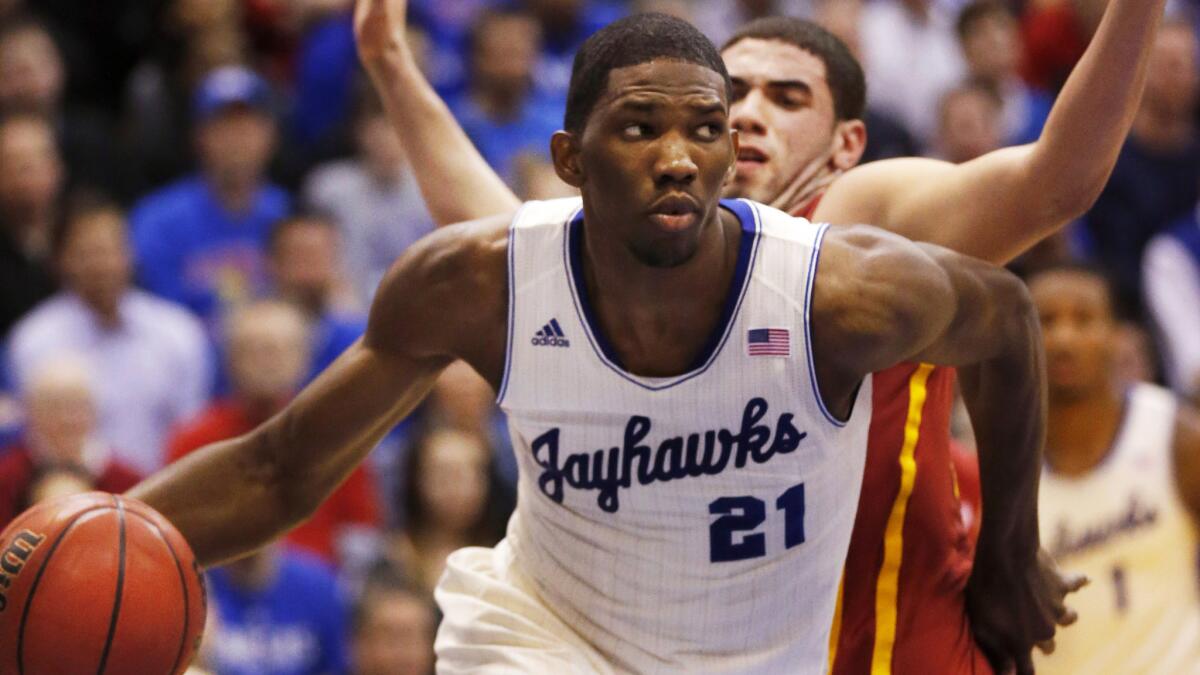 Kansas center Joel Embiid drives to the basket during a game against Iowa State in January 2014.