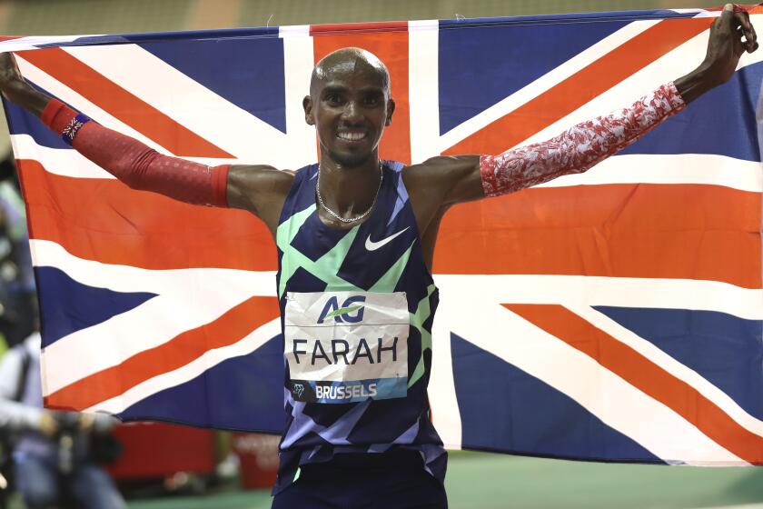 Great Britain's Mo Farah celebrates after winning the One Hour Men at the Diamond League.