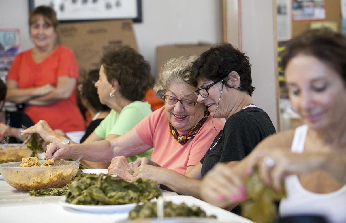 Members of the St. Mary Armenian Church Peggy Mussetti and Joyce Kechian prepare sarmas, or stuffed grape leaves, for the upcoming Armenian Festival on Tuesday, September 30. The festival will be held on Saturday and Sunday October 4 and 5 at the St. Mary Armenian Church in Costa Mesa.