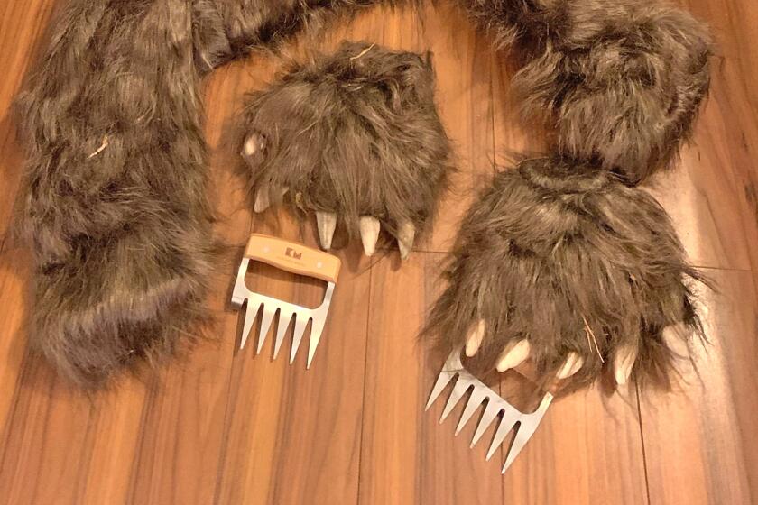 A bear suit, complete with claws, is part of the evidence used to convict three individuals for staged "bear" attacks on luxury cars for insurance payouts.