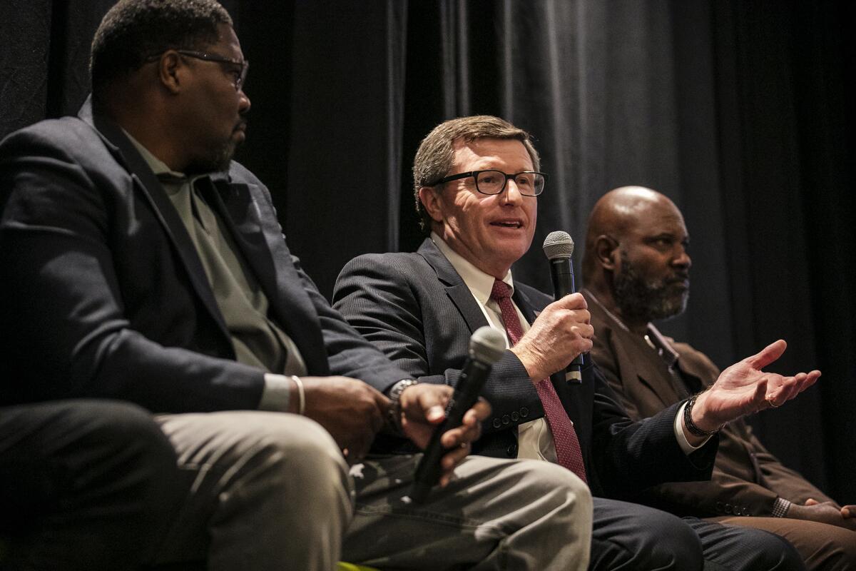 Judge Cormac Carney, center, speaks during the KidWorks annual Foundation for Success luncheon on Thursday in Santa Ana.