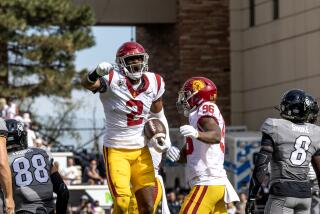 USC defensive end Romello Height celebrates after recovering a blocked punt against Colorado 