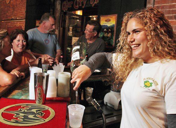 Millie Bringle is a bartender at the boisterous Meson de Pepe Cuban eatery and a real estate office manager by day. She's among the growing number of Key West residents who are having a hard time keeping up with skyrocketing home prices and a high cost of living.