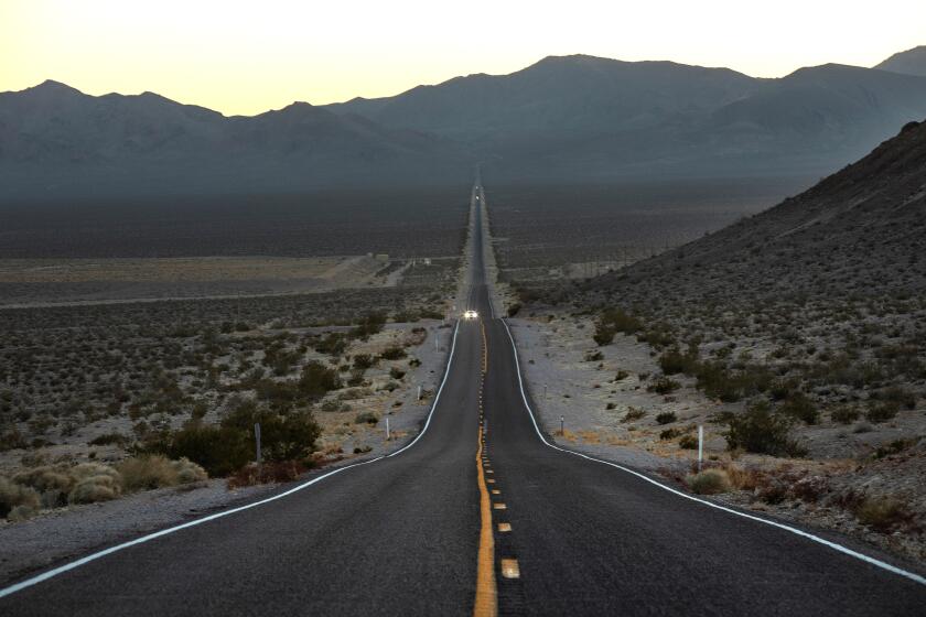 BEATTY, NV-FEBRUARY 19, 2020: A motorist travels along a desolate stretch of State Route 374 near Beatty, Nevada. (Mel Melcon/Los Angeles Times)