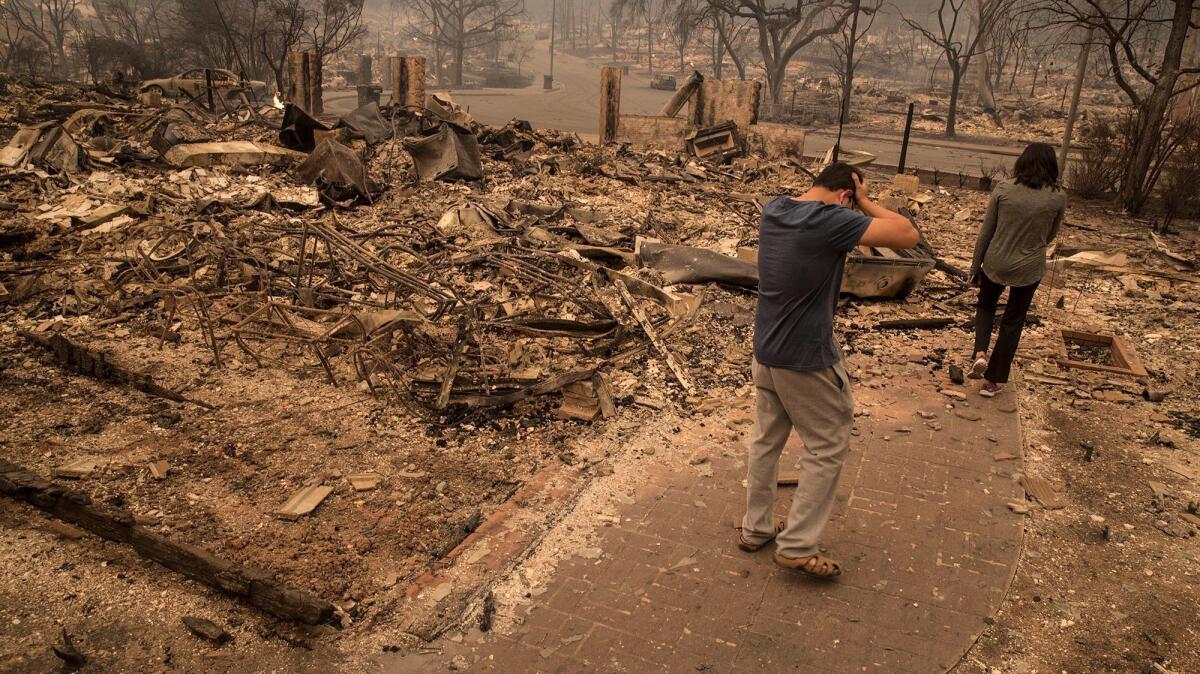 A Santa Rosa homeowner returns to survey what's left of his house of four years.