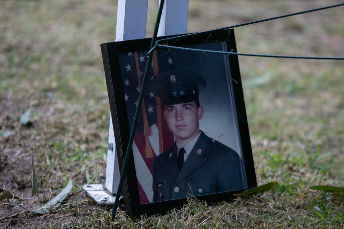 A photo of Army Pfc. Thomas F. Green, killed during the Vietnam War, is displayed during a ceremony at Nuevo Memory Gardens.