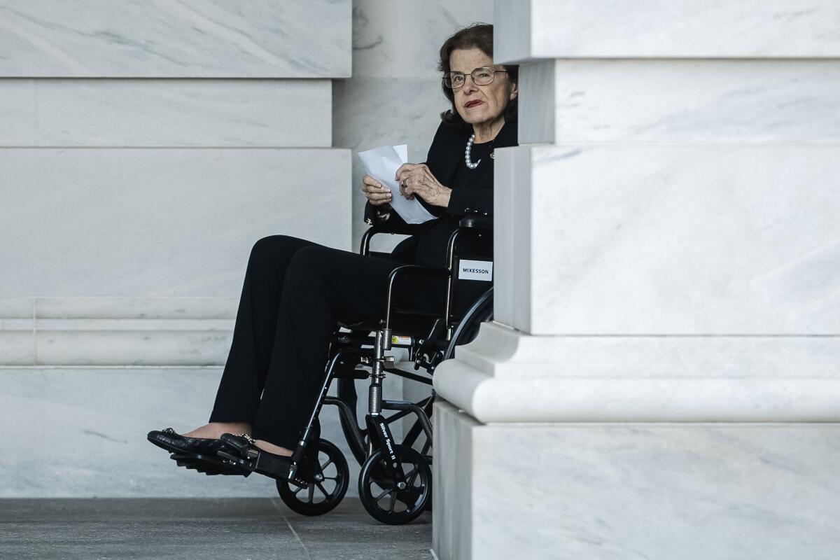 Sen. Feinstein in a wheelchair leaves the Capitol 