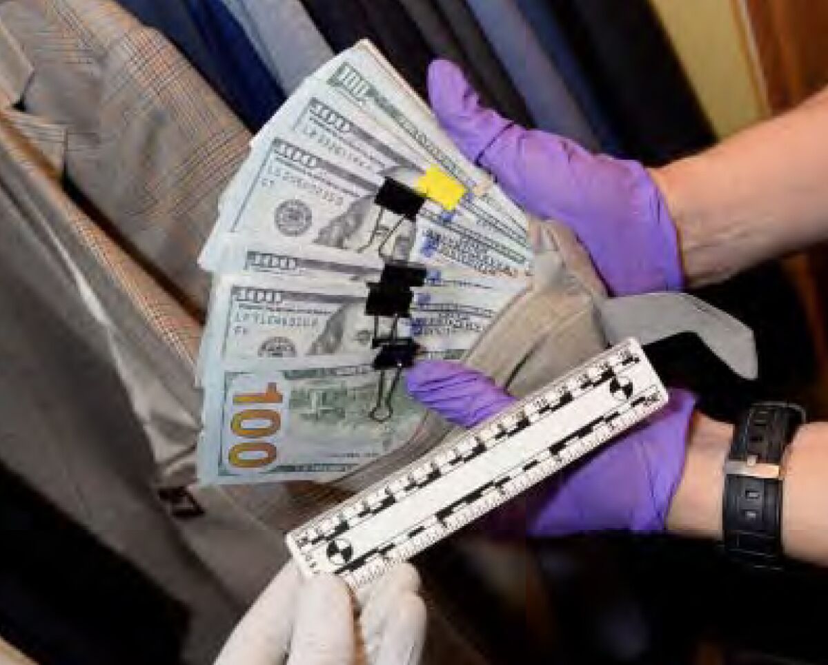 Clips of hundred-dollar bills