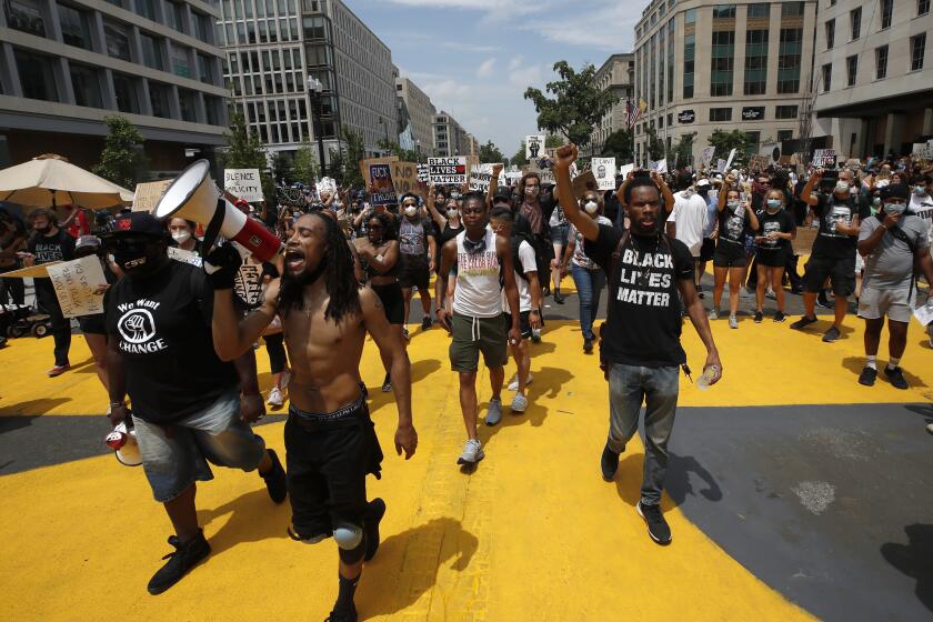 Demonstrators protest Saturday, June 6, 2020, near the White House in Washington, over the death of George Floyd, a black man who was in police custody in Minneapolis. Floyd died after being restrained by Minneapolis police officers. (AP Photo/Alex Brandon)