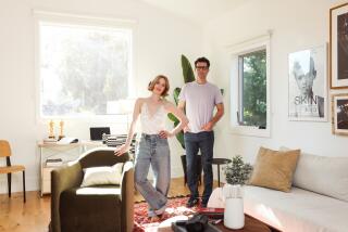 Los Angeles, CA - August 14: Jaime Ray Newman poses for a portrait with husband Guy Nattiv in the upstairs office of the ADU on their property in the valley on Wednesday, Aug. 14, 2024 in Los Angeles, CA. With the help of architect Juan Felipe Goldstein, the unit grew to a two-story creative hub with two separate dwellings, an ADU on the first floor and a second floor office. (Dania Maxwell / Los Angeles Times)