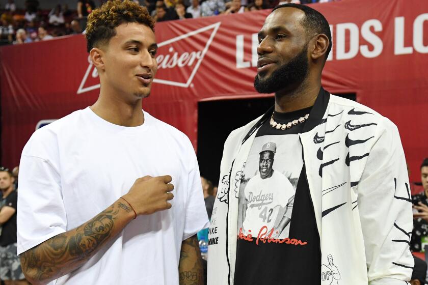 LAS VEGAS, NEVADA - JULY 06: Kyle Kuzma (L) and LeBron James of the Los Angeles Lakers talk before a game between the Lakers and the LA Clippers during the 2019 NBA Summer League at the Thomas & Mack Center on July 6, 2019 in Las Vegas, Nevada. NOTE TO USER: User expressly acknowledges and agrees that, by downloading and or using this photograph, User is consenting to the terms and conditions of the Getty Images License Agreement. (Photo by Ethan Miller/Getty Images)