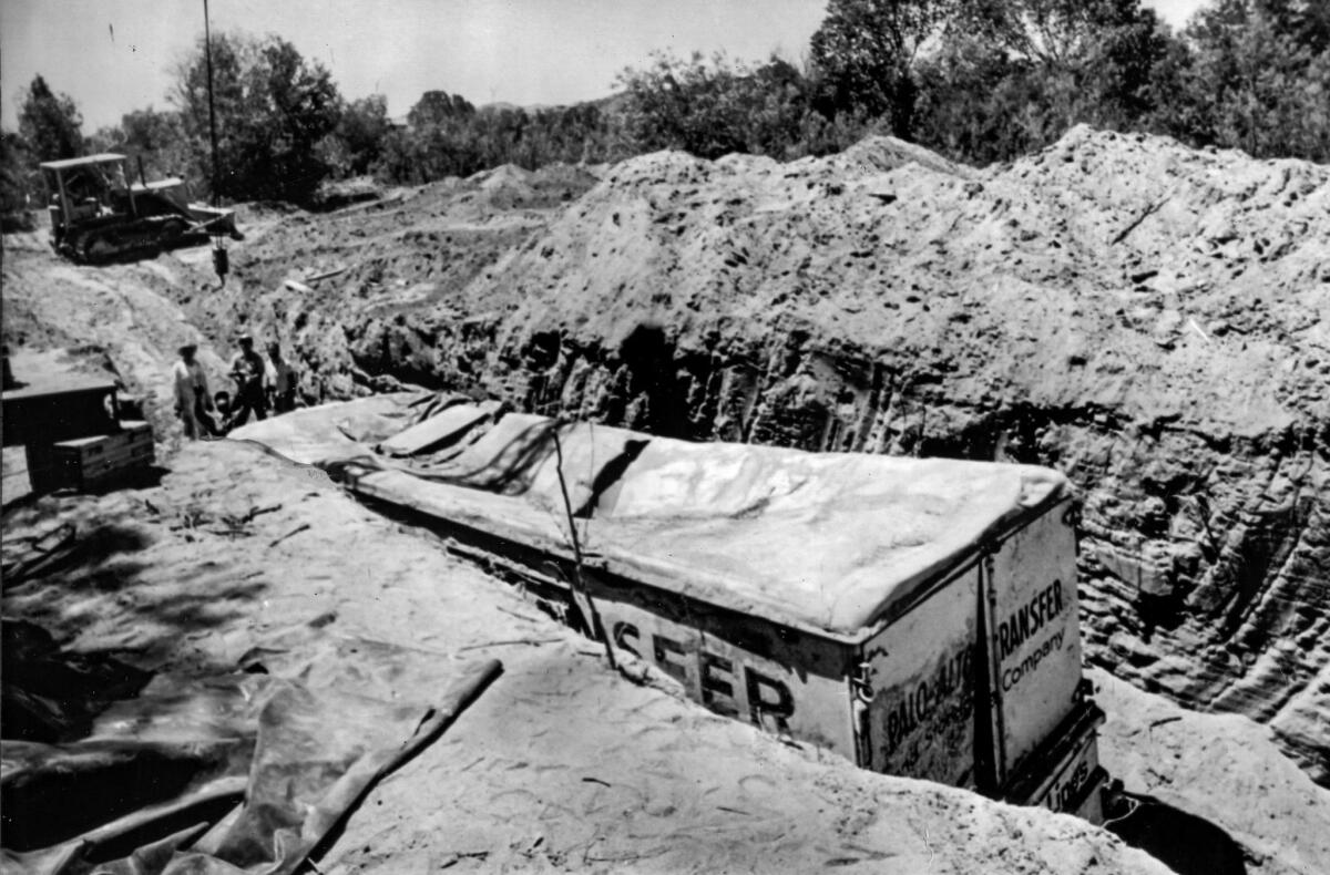 July 20, 1976: Moving van trailer in which the Chowchilla victims were imprisoned after being dug up by police at the Livermore quarry.