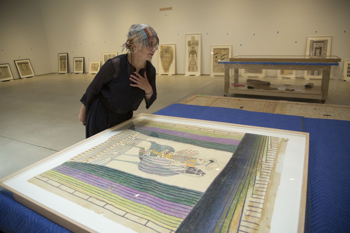 Elsa Longhauser looking at one of the works by Martín Ramírez. (Myung J. Chun / Los Angeles Times)