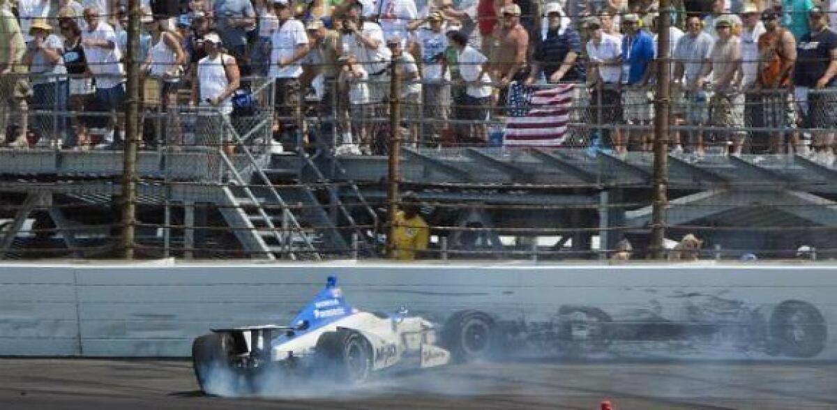 Takuma Sato's car comes to rest against the wall after crashing on the final lap of the Indy 500.