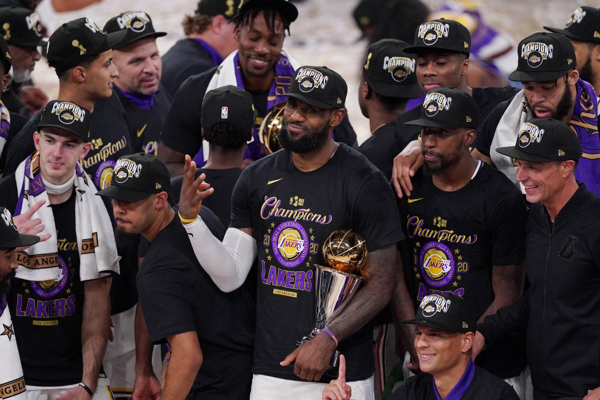 LeBron James (23) celebrates with teammates after the Lakers defeated the Miami Heat in Game 6 of the NBA Finals on Sunday.