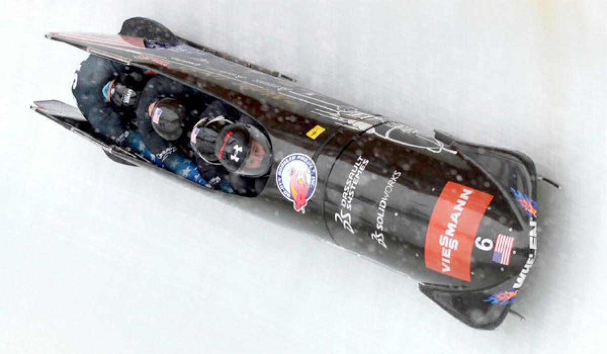 U.S. four-man bobsled pilot Steven Holcomb guides his sled through a World Cup course in Schoenau, Germany on Jan. 26. Holcomb and his team won gold in the Vancouver Olympic Games in 2010.