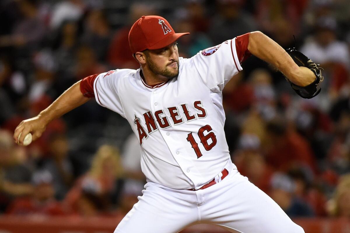 Angels closer Huston Street delivers a pitch against the Rockies in the ninth inning Wednesday night in Anaheim.